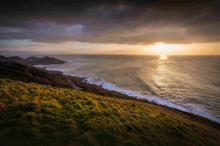 A winter sunset reflects on Swansea Bay