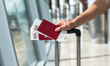 generic-man-with-suitcase-passport-tickets