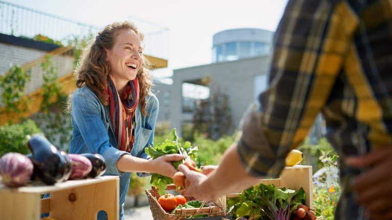 woman-selling-vegetables-on-farmers-market